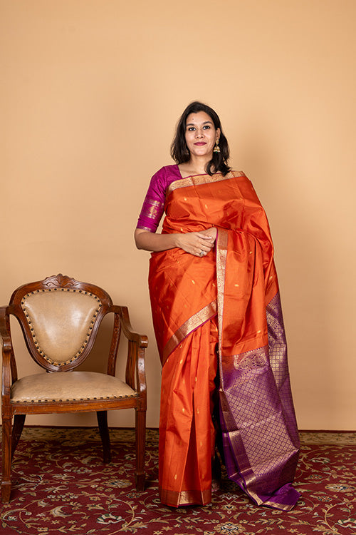 Dual tone orange small border silk saree