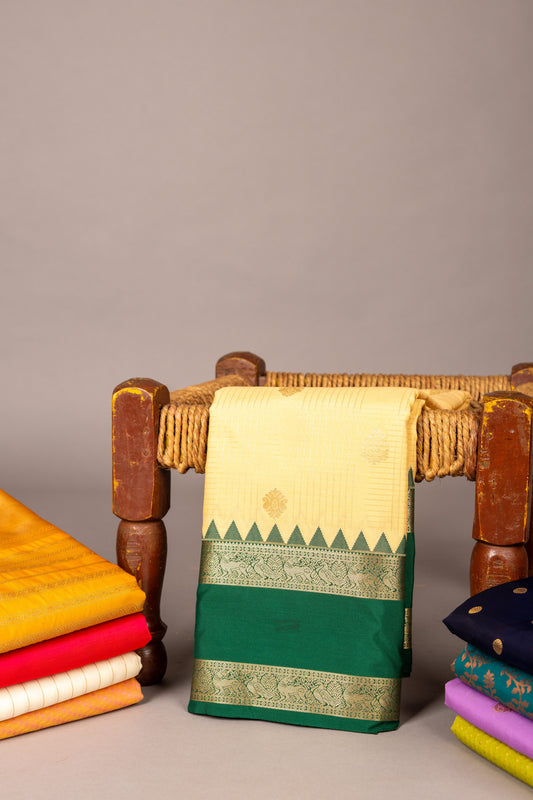 Offwhite and emerald greem semi saree