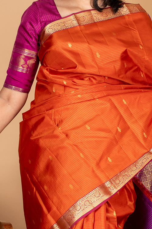 Dual tone orange small border silk saree