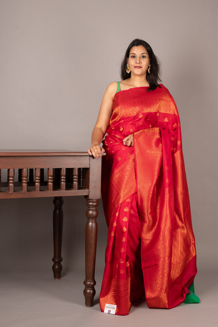Red and green small border silk saree