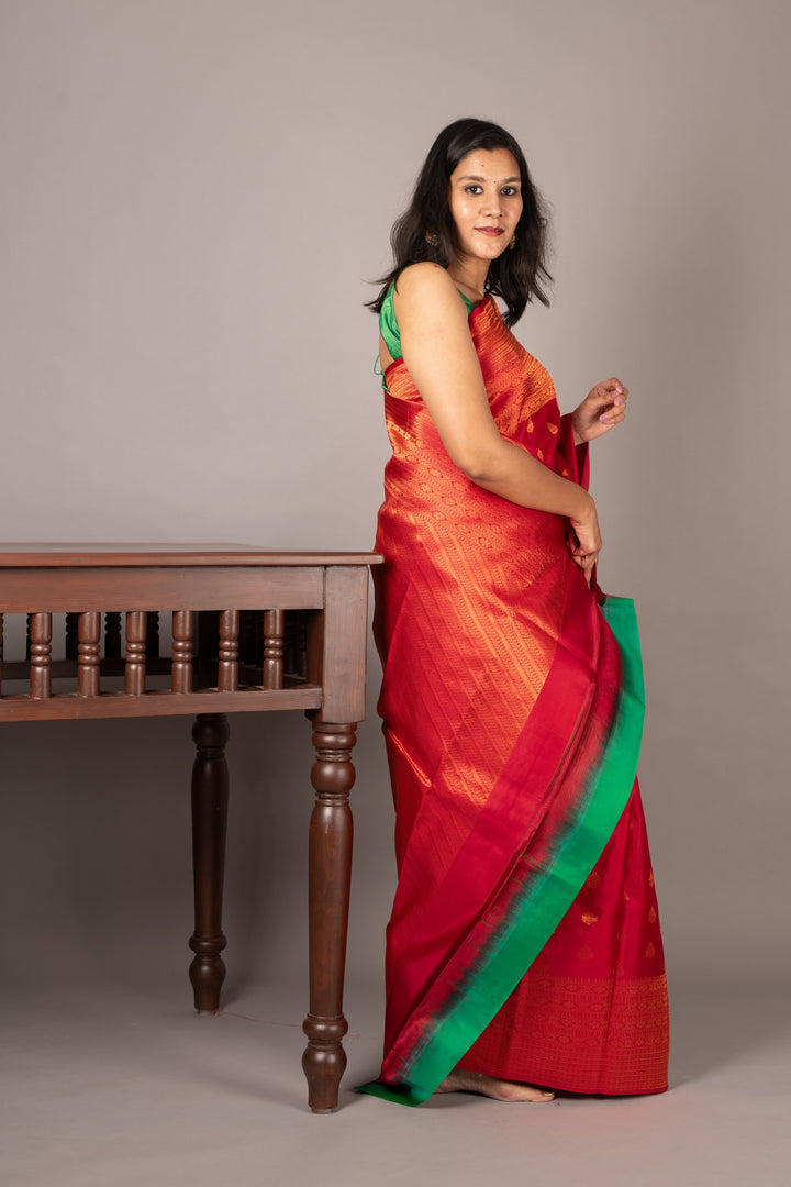 Red and green small border silk saree
