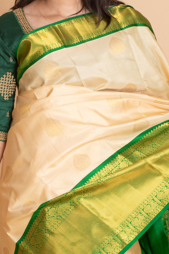 Parchment White and Emerald Green pure Kanjivaram Silk Saree