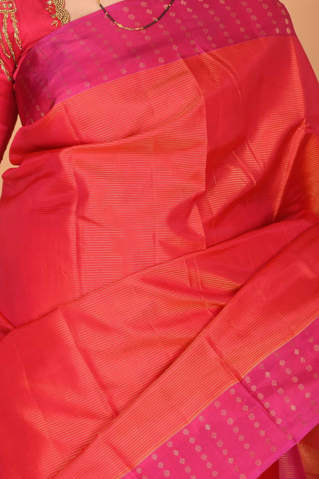 Dual Tone Orange and Rani pink zari striped pure kanchi silk saree