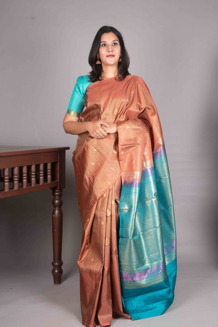 Copper Orange And Teal Blue Borderless Silk Saree