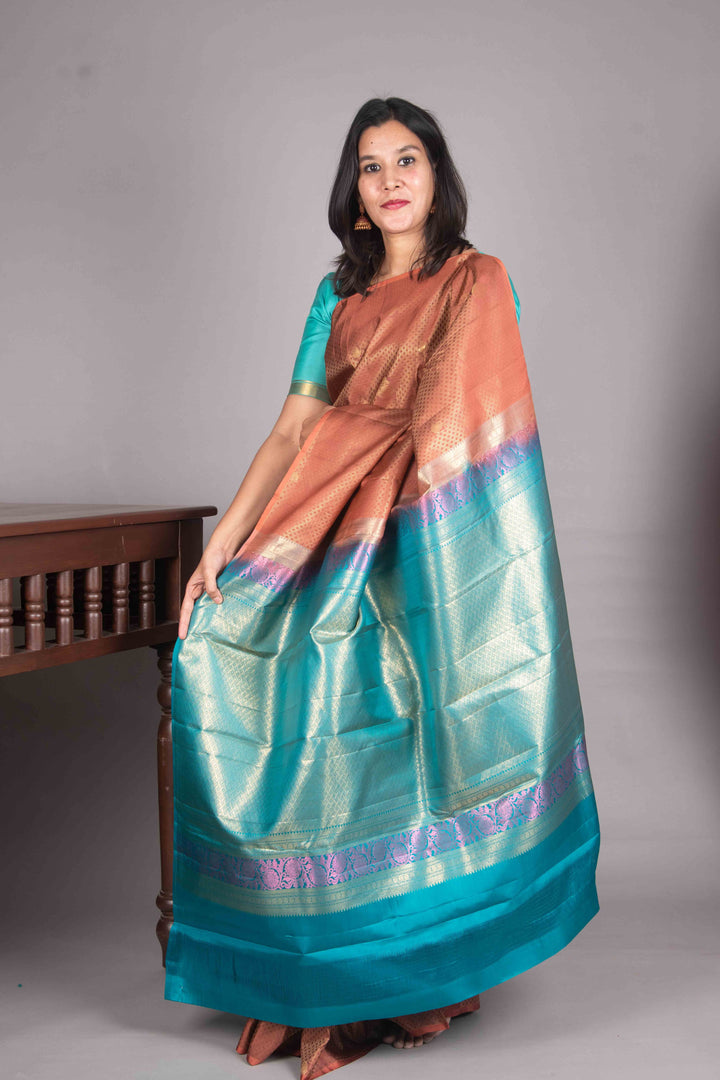 Copper Orange And Teal Blue Borderless Silk Saree