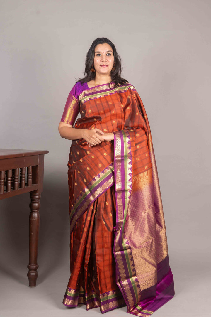 Rust Orange And Purple Temple Border Silk Saree
