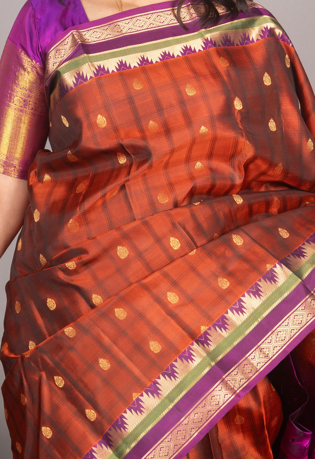 Rust Orange And Purple Temple Border Silk Saree