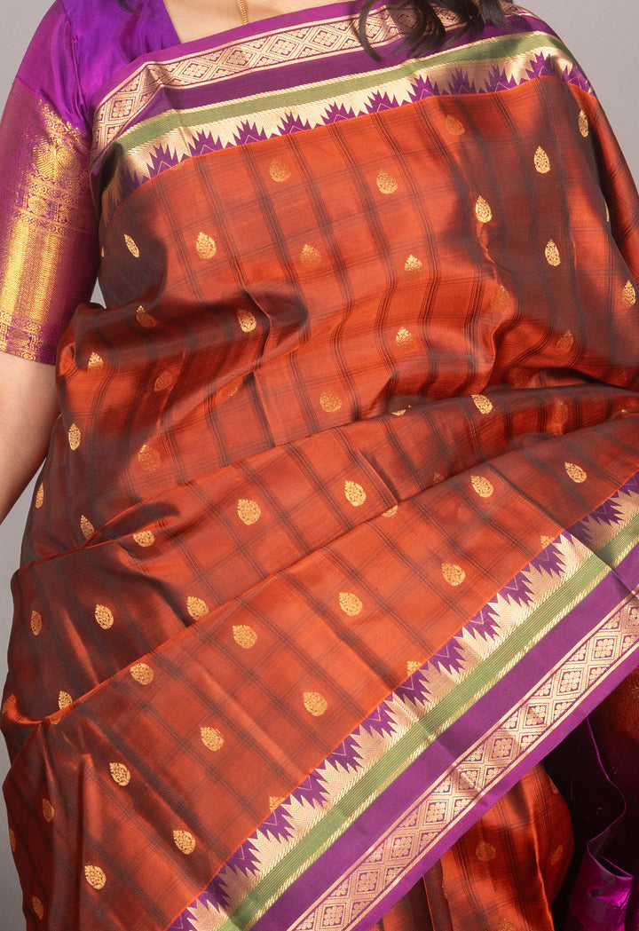 Rust Orange And Purple Temple Border Silk Saree