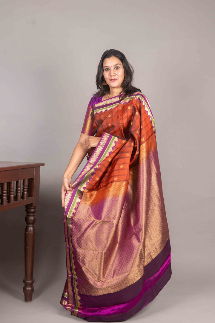 Rust Orange And Purple Temple Border Silk Saree