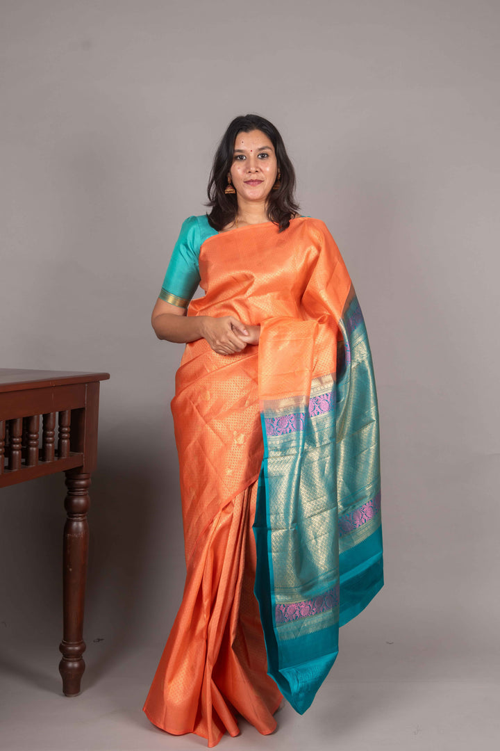 Peach And Teal Borderless Kachi Silk Saree