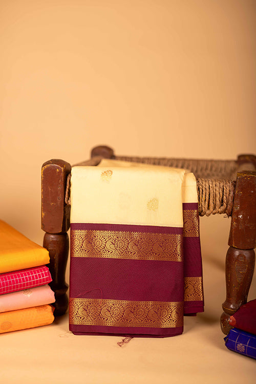 Offwhite and maroon semi soft silk saree
