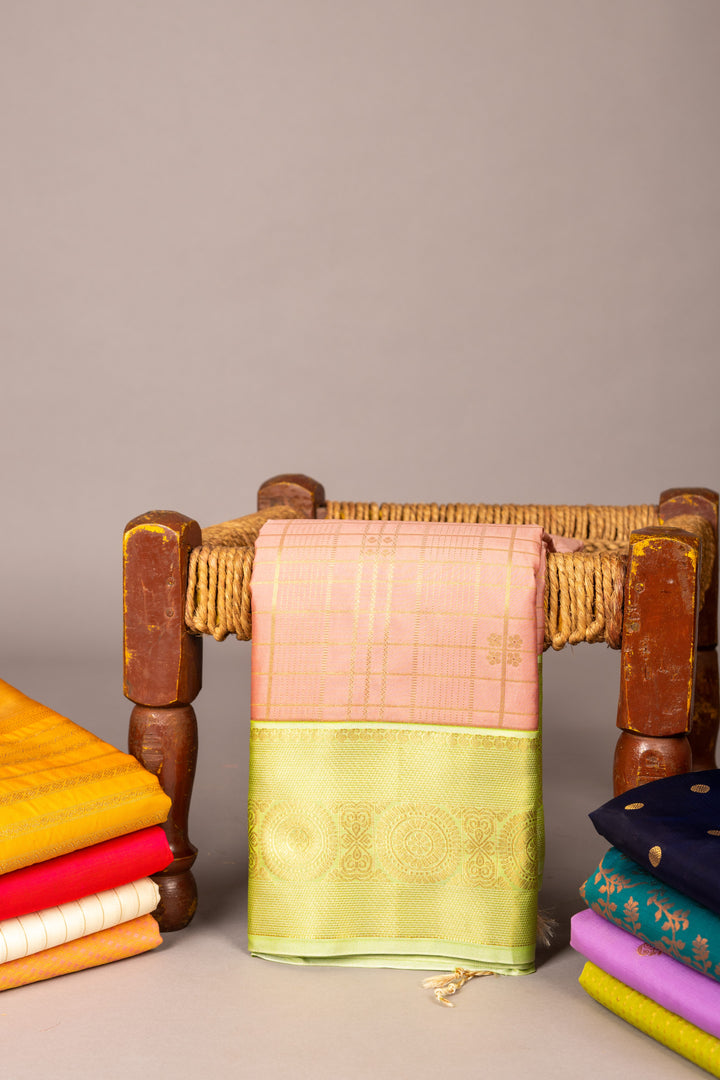 Pastel peach and green soft silk saree