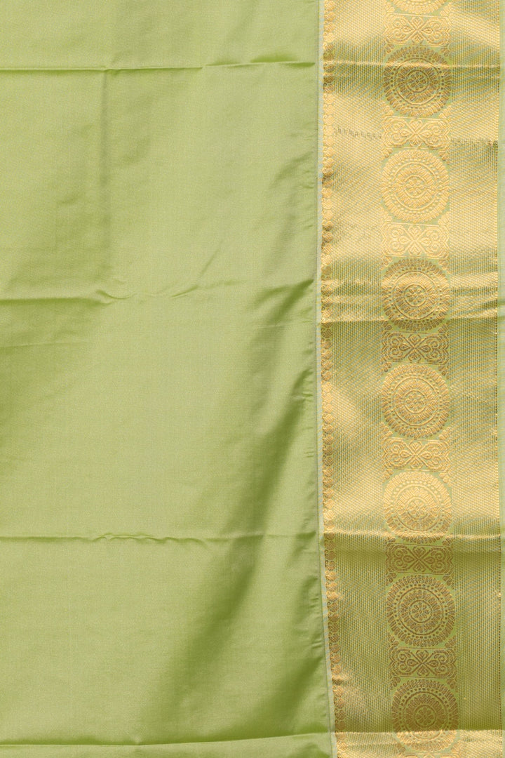 Pastel peach and green soft silk saree