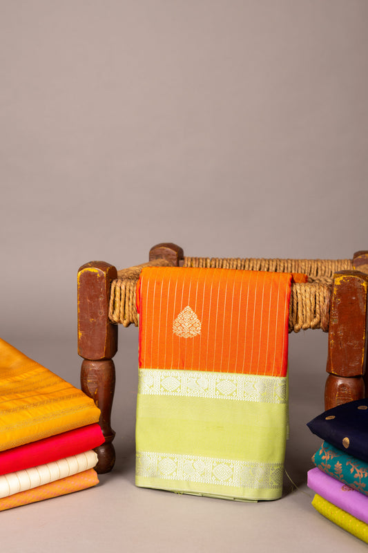 Golden orange and pastel green semi silk saree