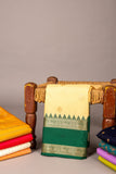 Offwhite and emerald greem semi saree