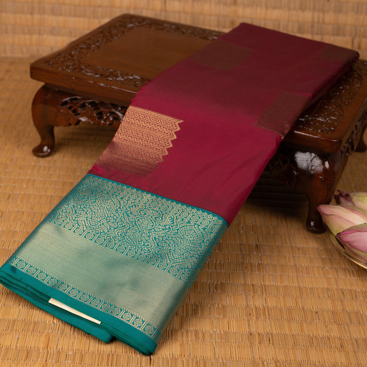 Maroon teal green semi silk saree