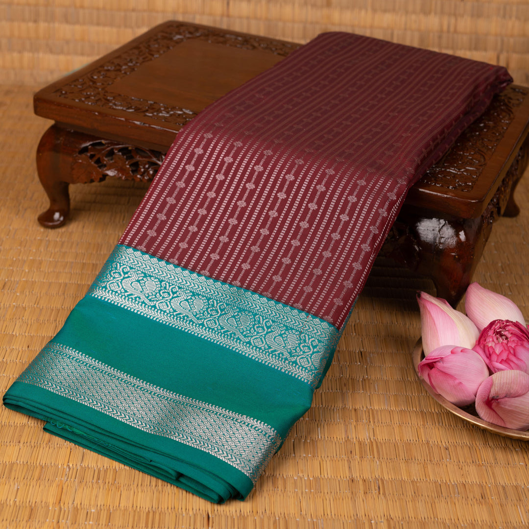 Maroon and Peacock green semi silk saree