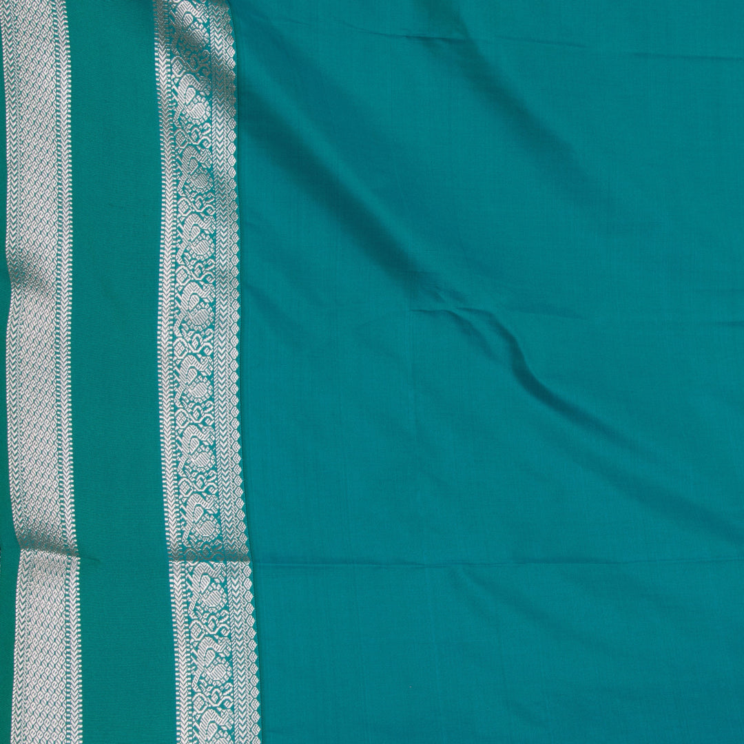 Maroon and Peacock green semi silk saree