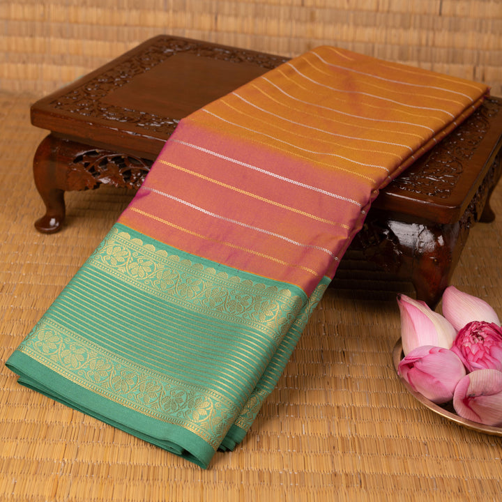 Dual tone orange and Persian green semi silk saree