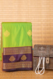 Lawn green and purple semi silk saree