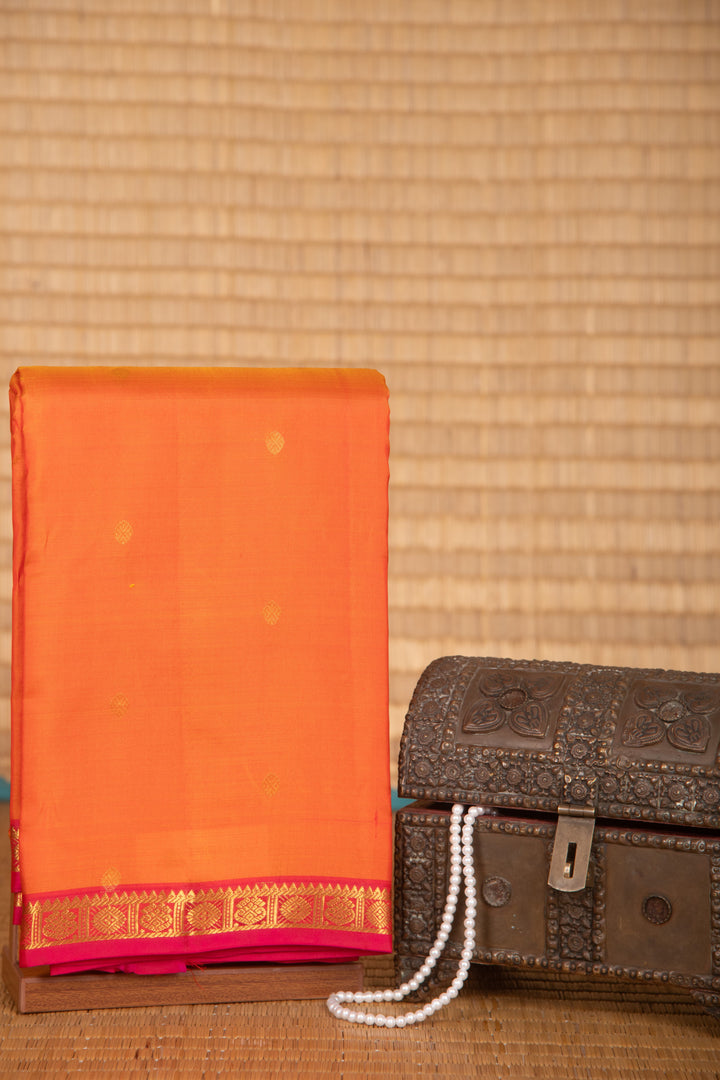 Dual tone orange and pink small border pure silk saree