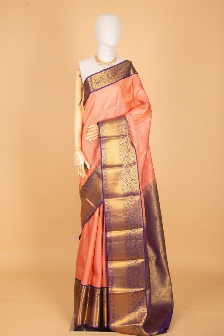 Peachish pink and purple bridal silk saree