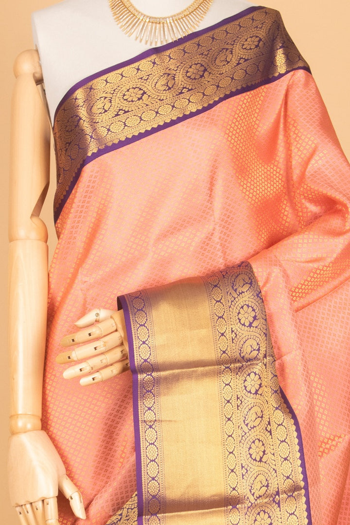 Peachish pink and purple bridal silk saree