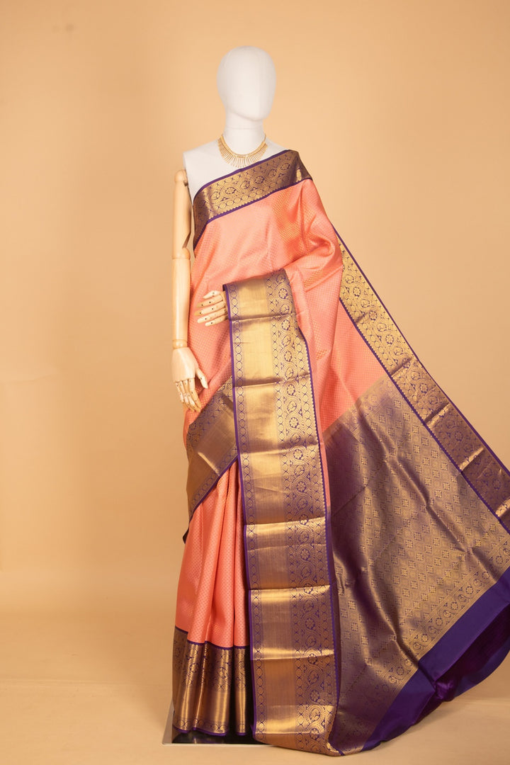 Peachish pink and purple bridal silk saree