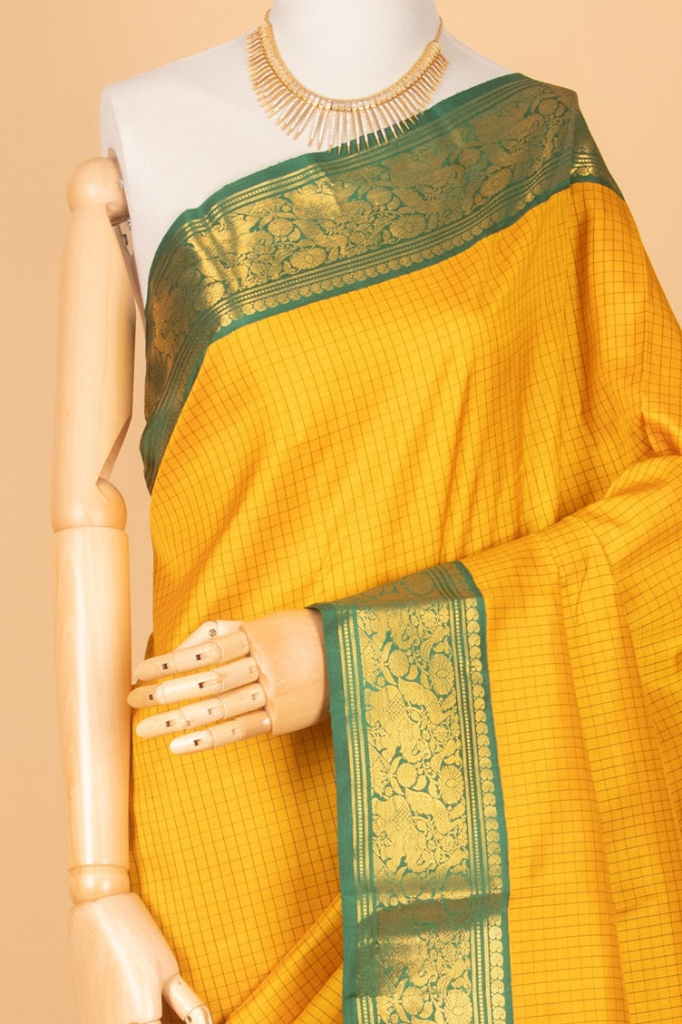 Golden yellow and green korvai traditional silk saree