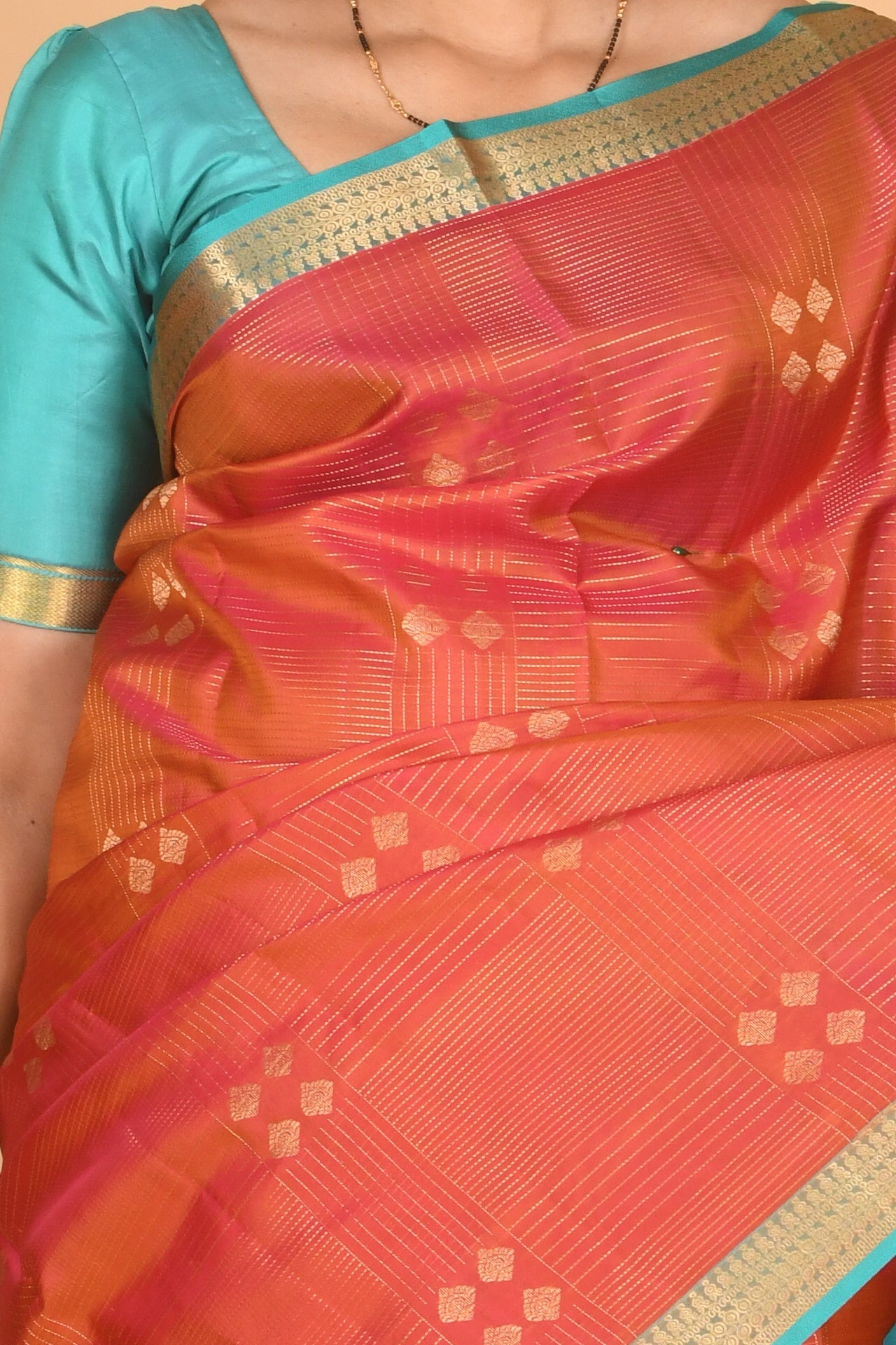 Dual tone orange and teal pure silk saree