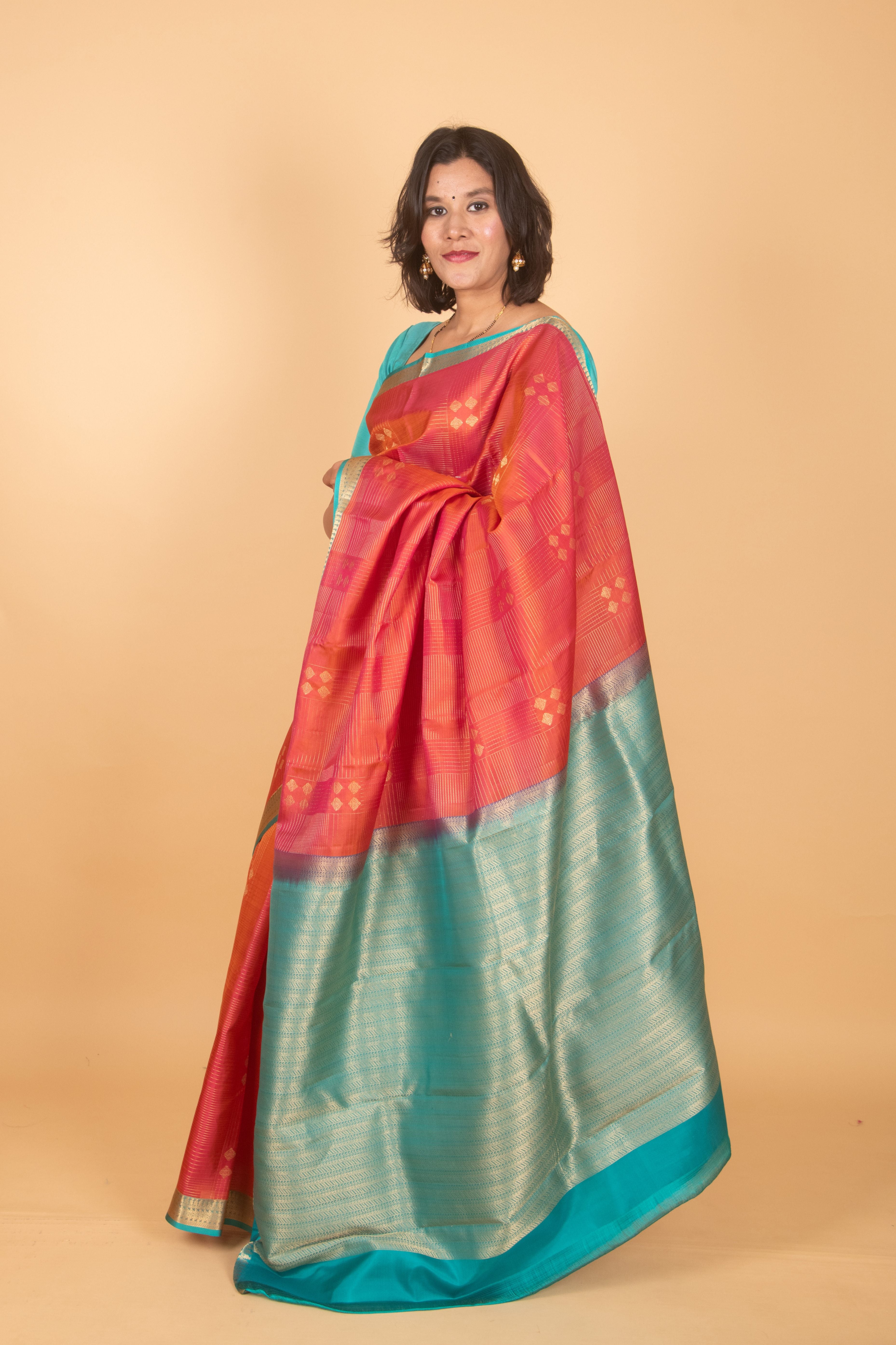 Dual tone orange and teal pure silk saree