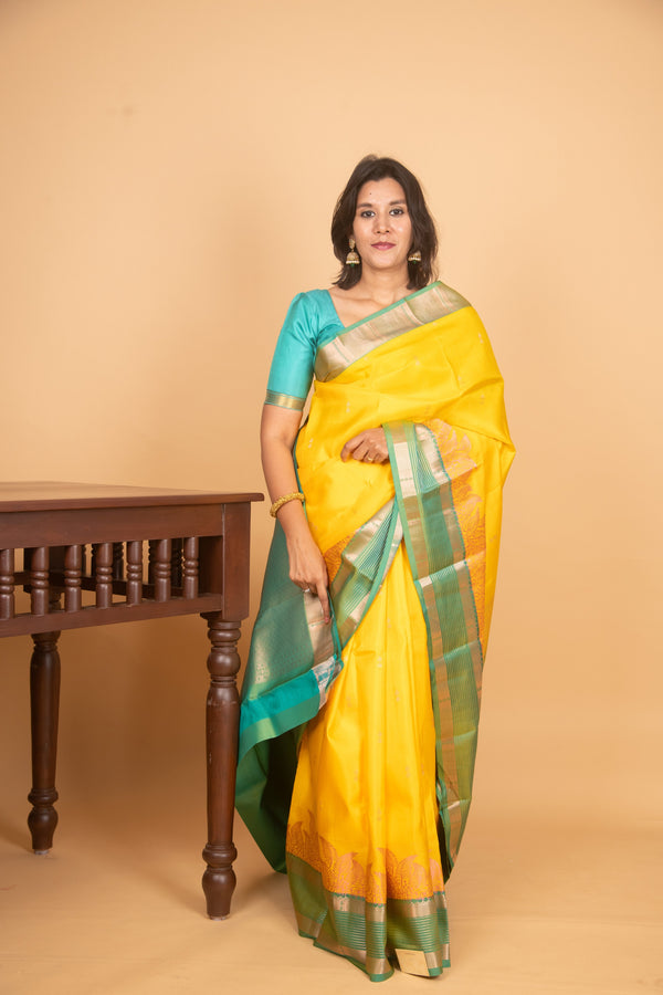 Dandelion yellow and golden turquoise silk saree