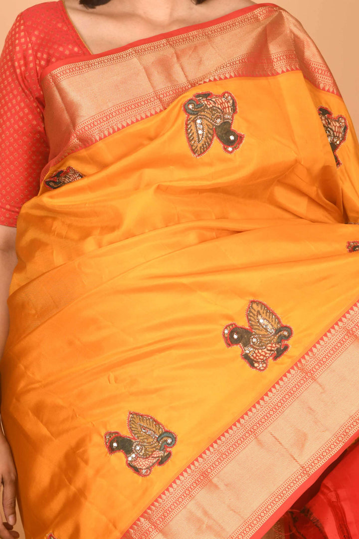Yellow and red kalamkari embellished pure kanchi silk saree