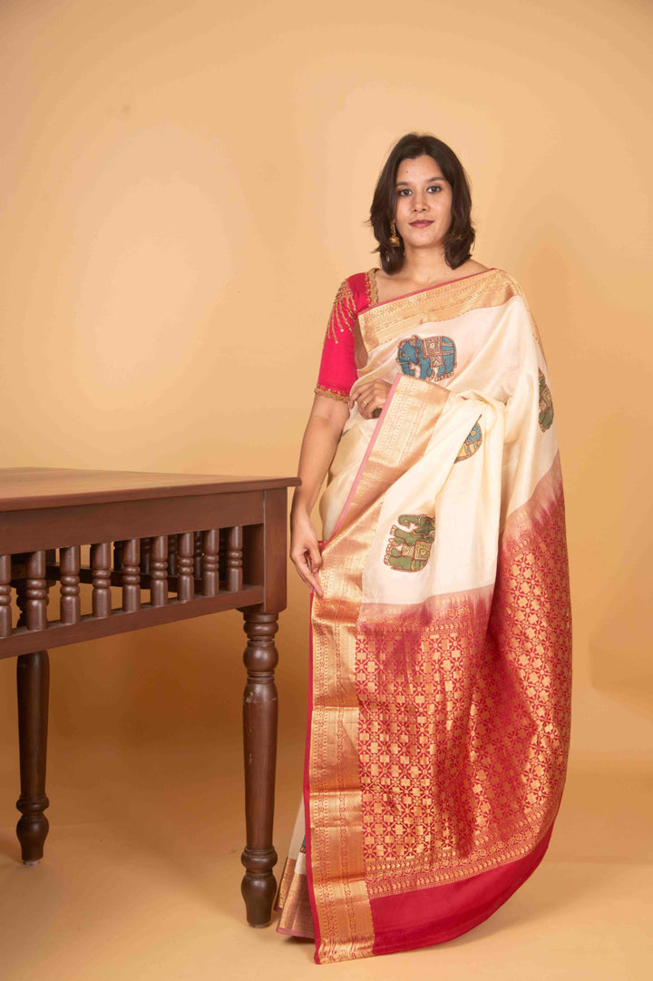 Offwhite and red kalamkari embellished pure kanchi silk saree