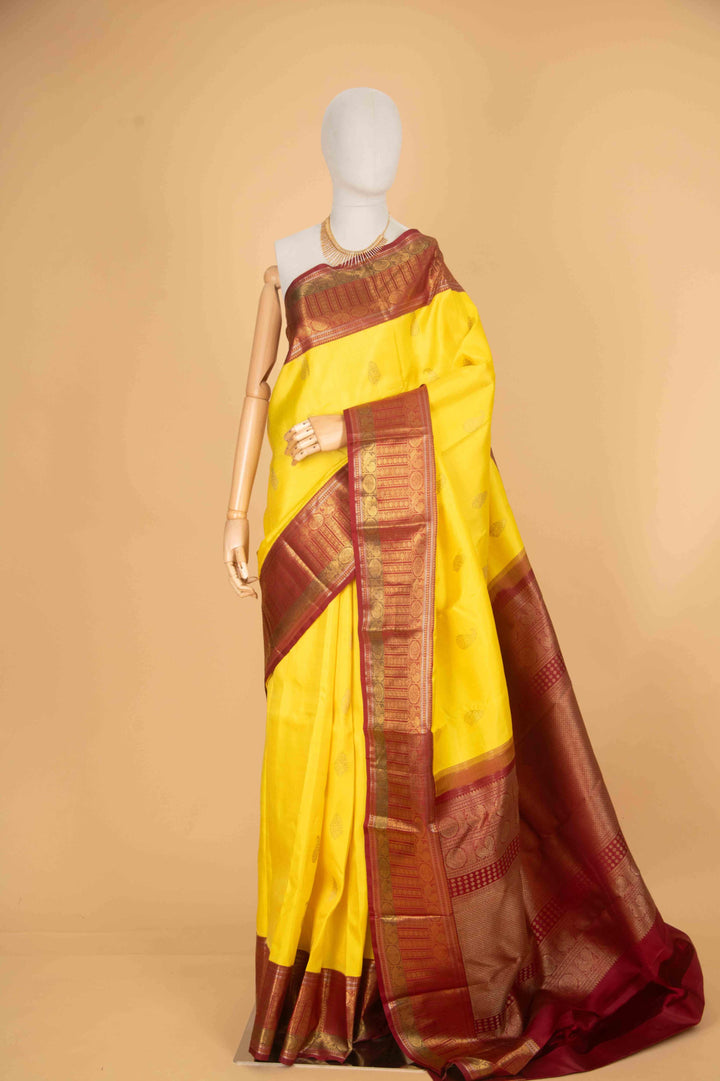 Lemon yellow and red pure zari silk saree