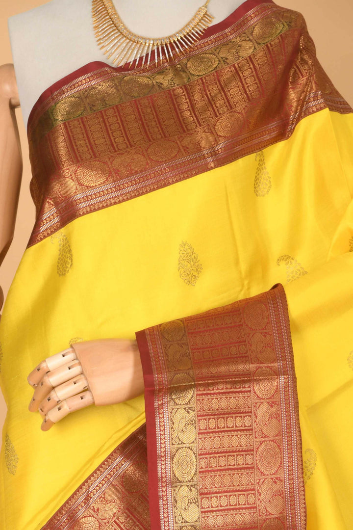Lemon yellow and red pure zari silk saree