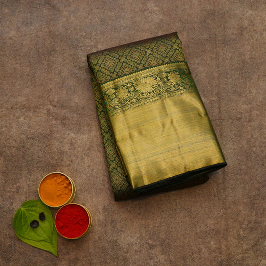 Dark green pattu saree for wedding