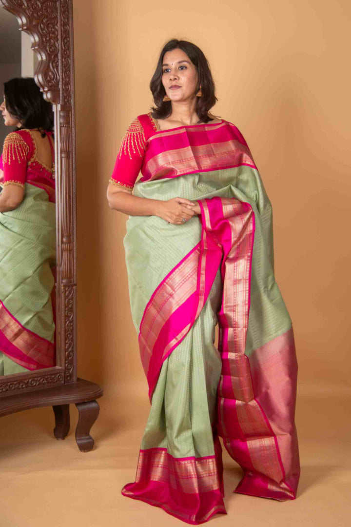 Tea green and pink aayiram butta silk saree