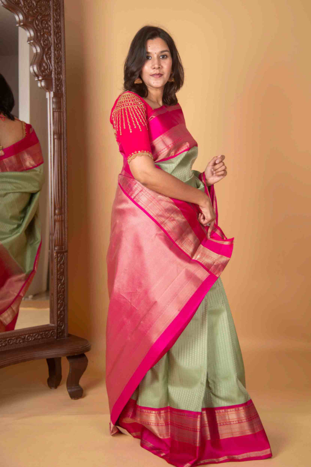 Tea green and pink aayiram butta silk saree