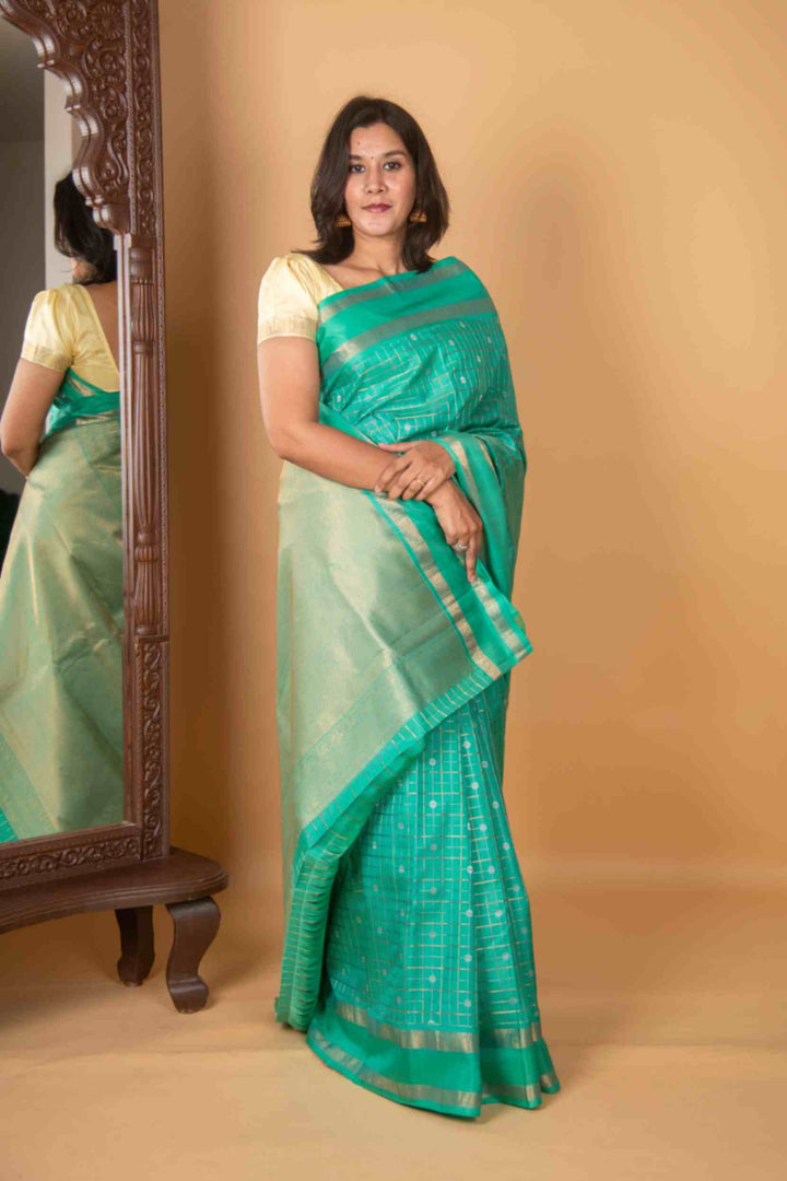 Aqua green zari kattam silk saree