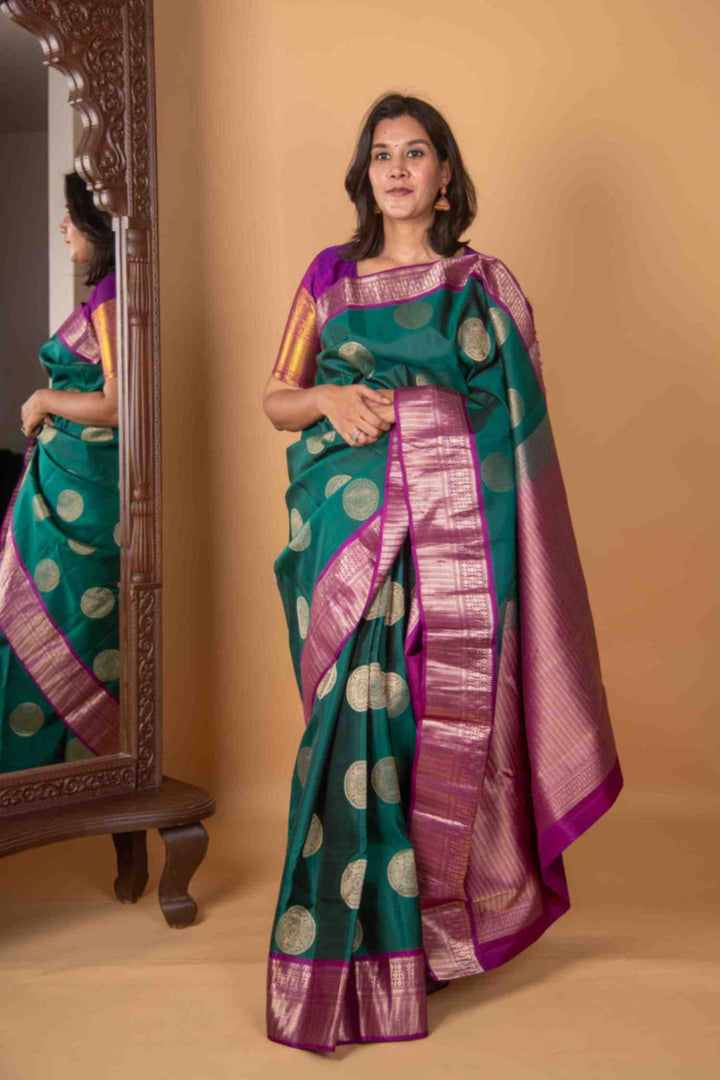 Pine green and magenta silk saree