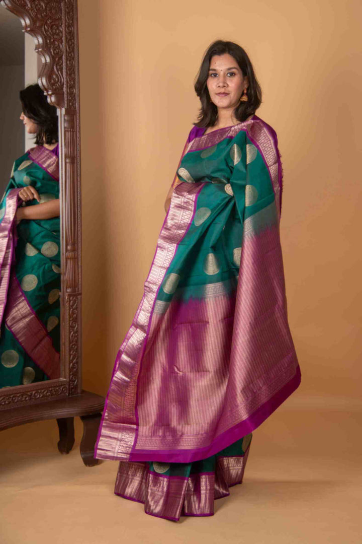 Pine green and magenta silk saree