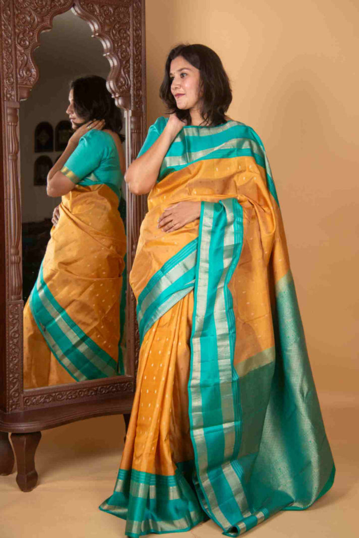 Gold and teal korvai silk saree