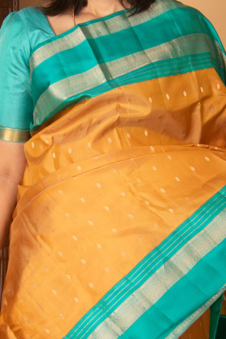 Gold and teal korvai silk saree