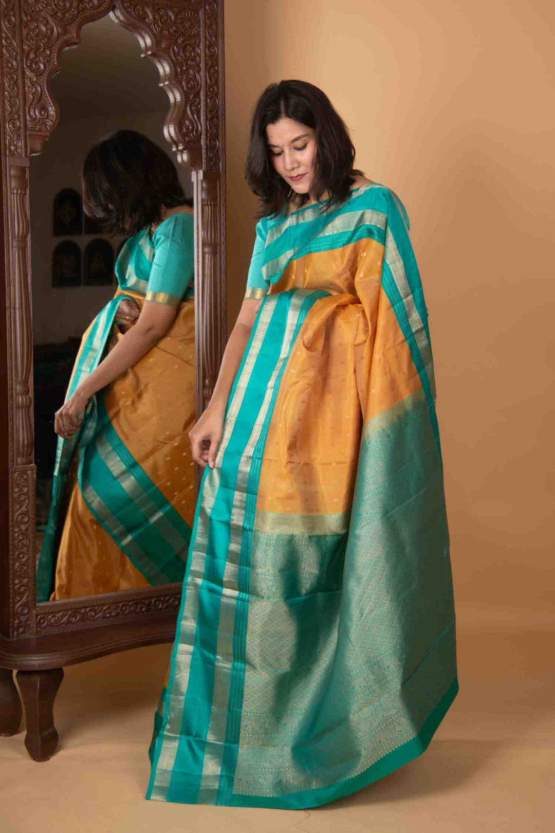 Gold and teal korvai silk saree