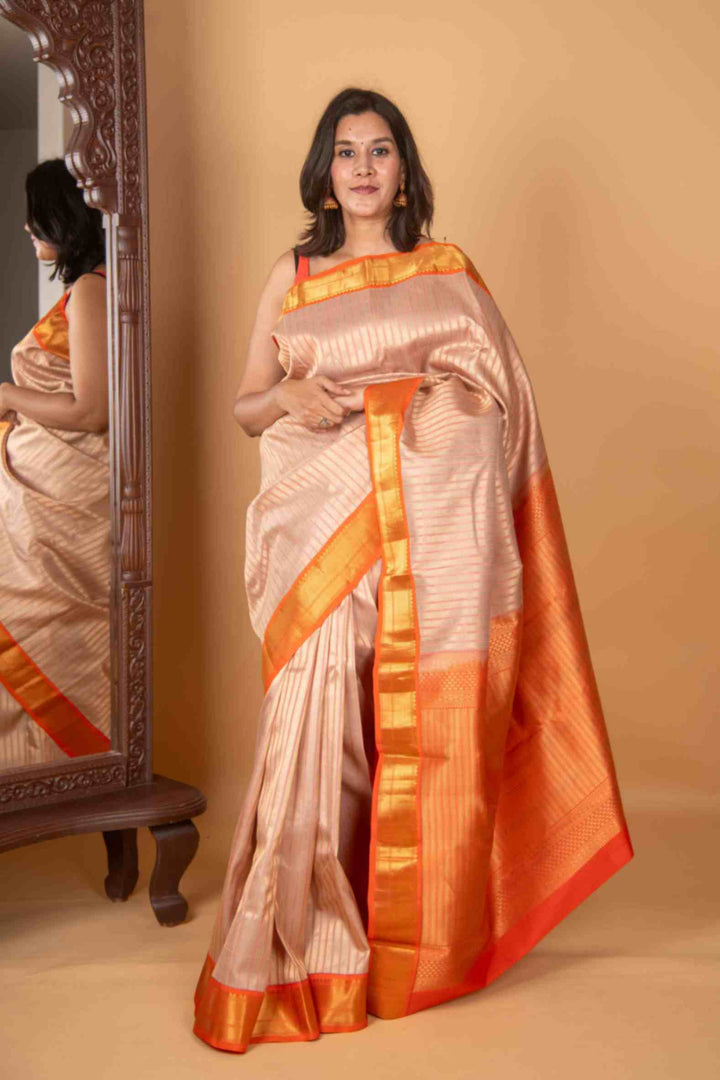 Offwhite and orange silk saree