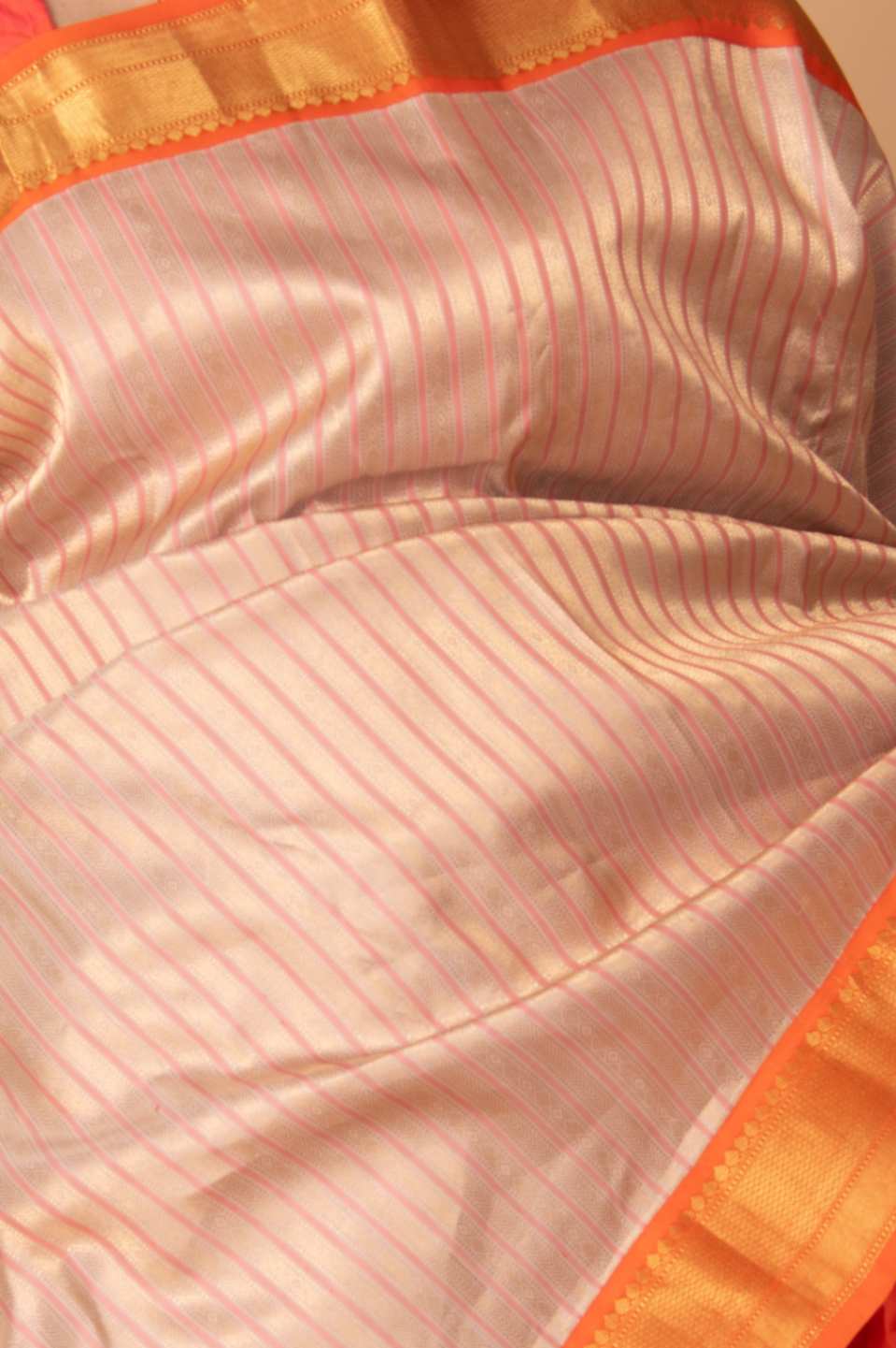 Offwhite and orange silk saree
