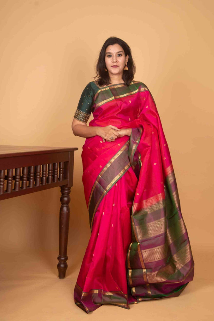 Budrose pink and manthulir green retta pettu silk saree