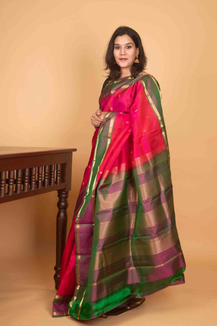 Budrose pink and manthulir green retta pettu silk saree