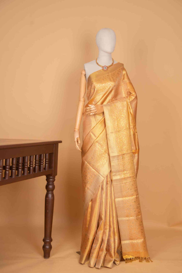 Peachish gold tissue silk saree